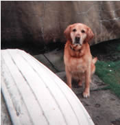 Kim beside the dinghy and Grandads boat