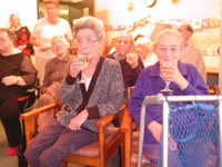 Jessie enjoys a festive drink with her best friend (Gran) during my All Singing All Dancing festive juggling show!
